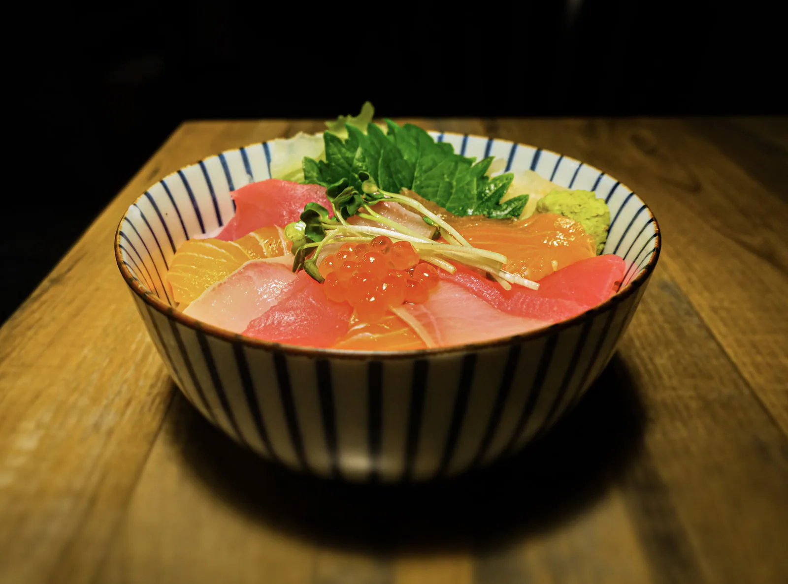 Trio don with tuna, salmon and ikura over rice